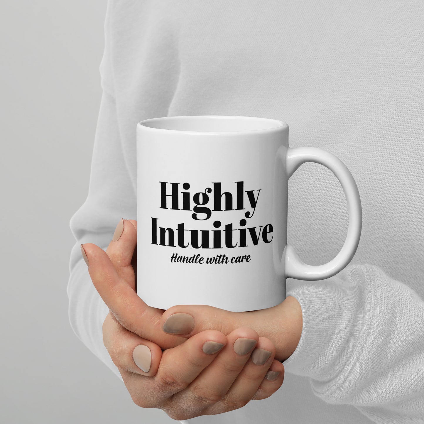 white mug with highly intuitive handle with care