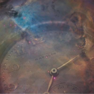 face of clock with misty colors over it